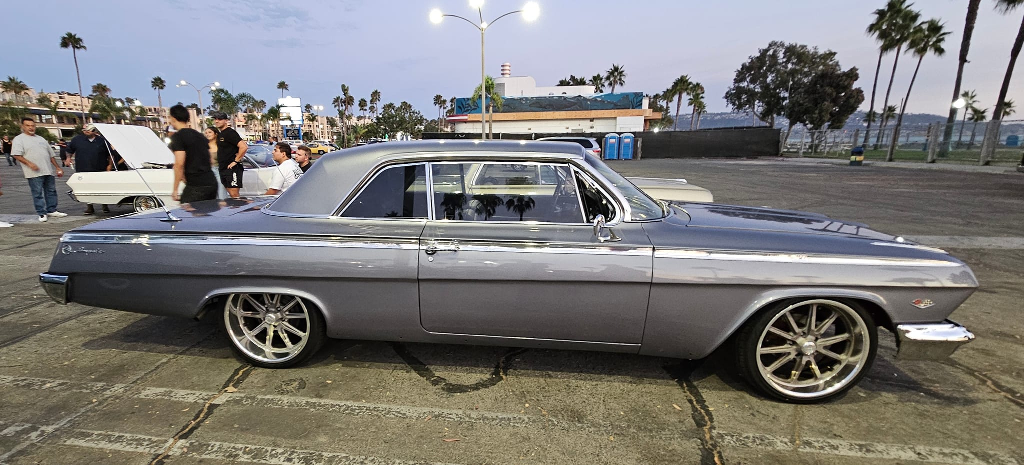 silver convertible cruising the beach